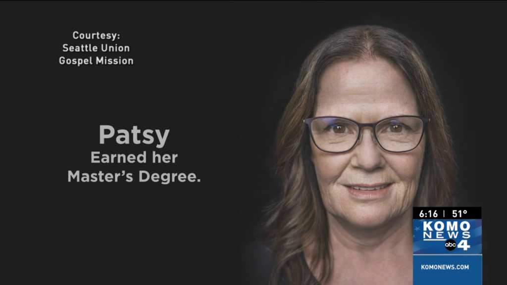 A screenshot of one of the portraits from Seattle Union Gospel Mission’s campaign to project images of formerly homeless people to raise awareness for the homeless crisis. Here, Patsy has earned her Master’s Degree.