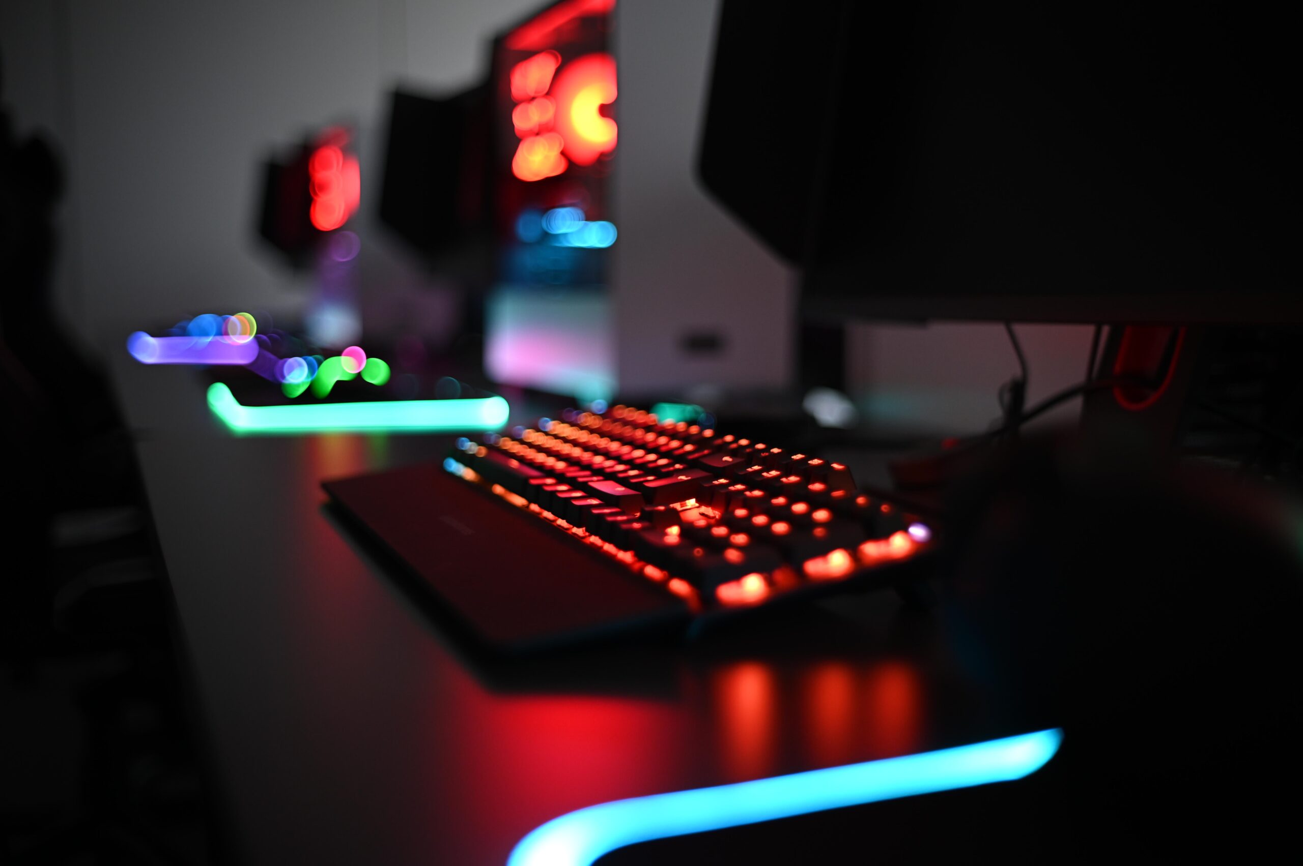 Backlit gaming keyboard and mouse set up for an esports competition.