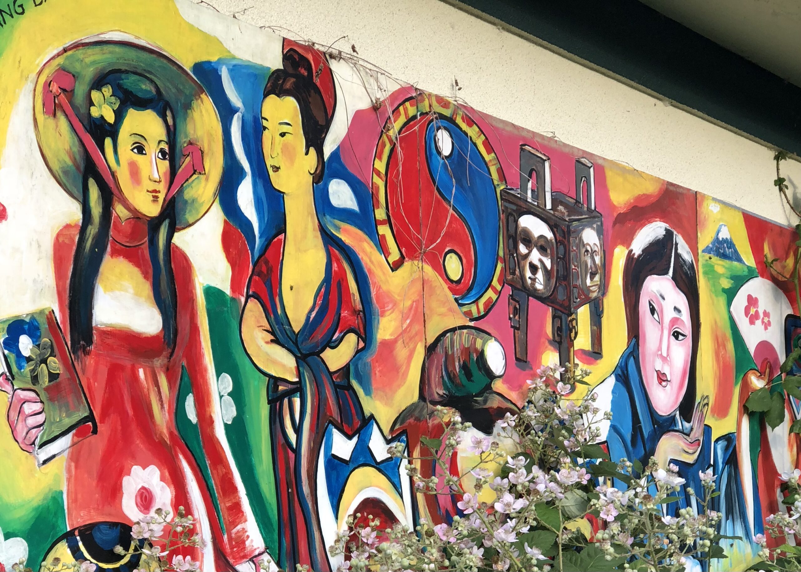 A mural the author took at the now defunct Hong Kong Seafood Restaurant in Rainier Beach, Seattle WA. It depicts Asian women from various cultures, as well as characters from Asian mythology.
